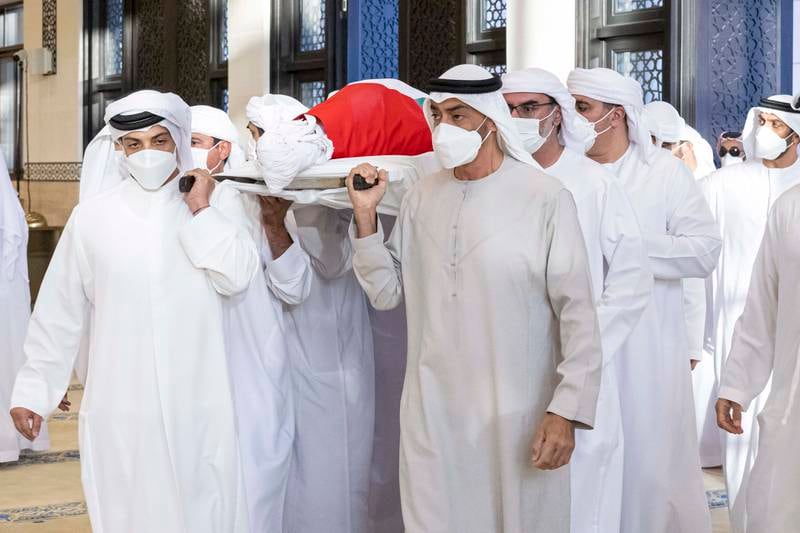 Sheikh Mohamed and Sheikh Mansour bin Zayed, Deputy Prime Minister and Minister of Presidential Affairs, help carry the body of Sheikh Khalifa. Photo: Ministry of Presidential Affairs