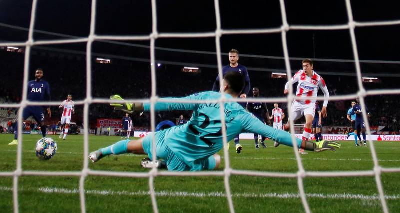 Tottenham Hotspur goalkeeper Paulo Gazzaniga saves from Red Star Belgrade's Milan Pavkov. Reuters
