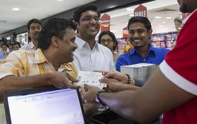 Chennai Super Kings fan Natarajan Suresh is first in line to get his hands on seven IPL match tickets. Mona Al Marzooqi / The National