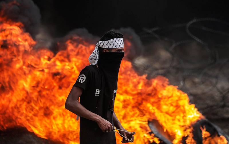 A Palestinian protester during clashes after Friday protests near the border with Israel in eastern Gaza City. Mohammed Saber / EPA