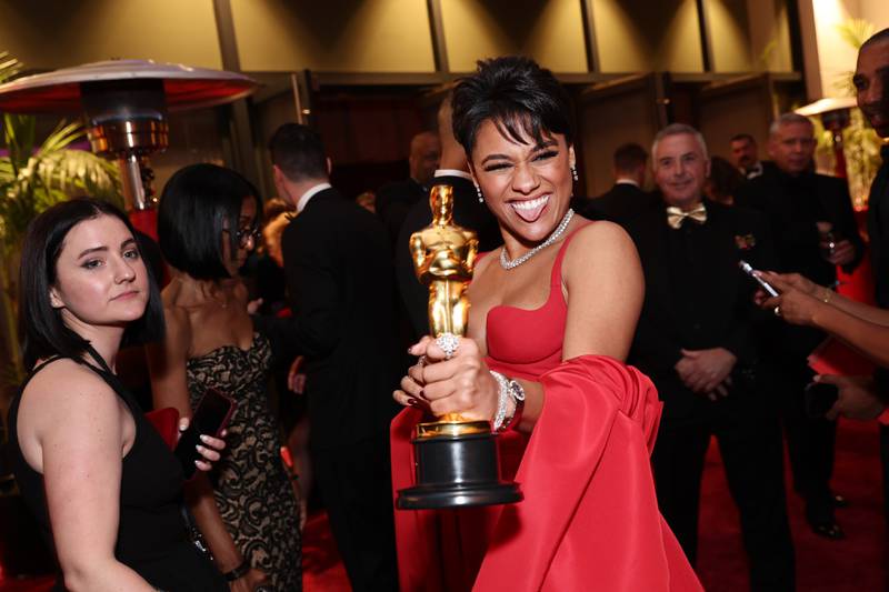 Ariana DeBose shows off her Oscar after scooping the Best Supporting Actress gong for Westside Story at last year's ceremony. AFP