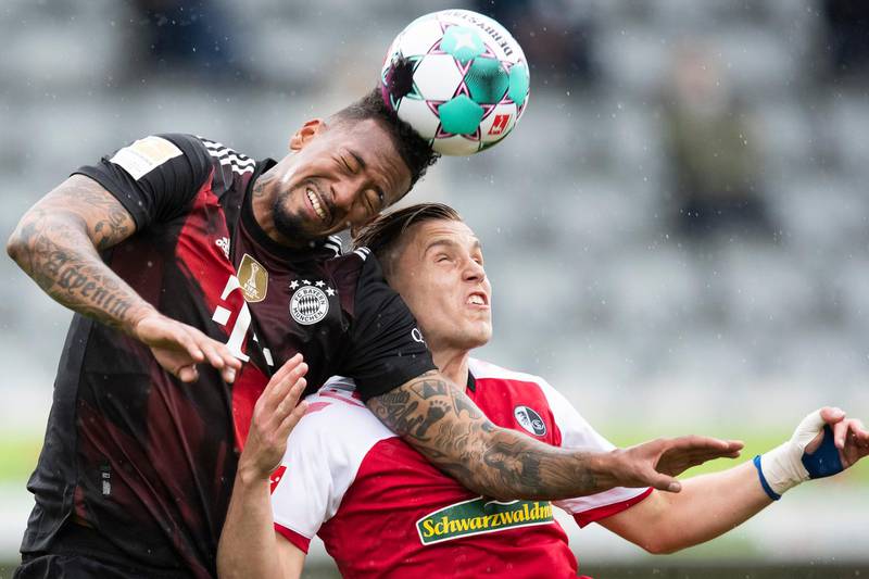 Bayern's Jerome Boateng and Ermedin Demirovic of Freiburg challenge for a header. AP