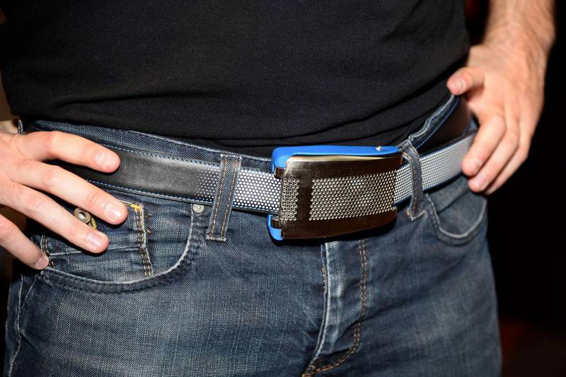 An Emiota representative wears Belty, a smart belt from Paris-based Emiota, at CES Unveiled, at the 2015 Consumer Electronics Show media preview day. Robyn Beck / AFP photo