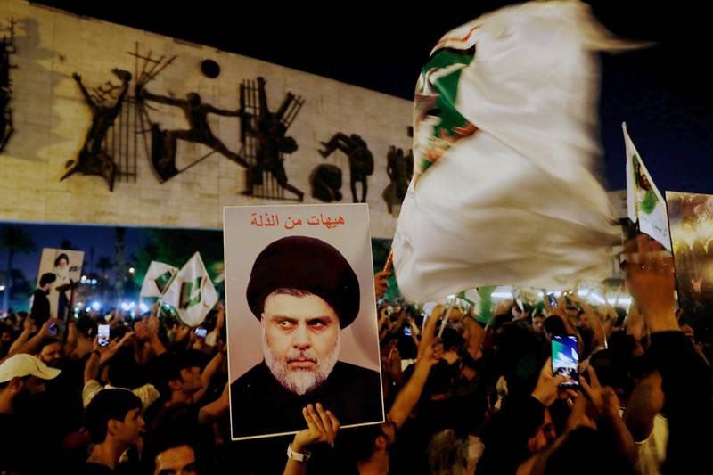 Supporters of Shiite cleric Moqtada Al Sadr celebrate the announcement of the results of the parliamentary elections in Tahrir Square, Baghdad. AP