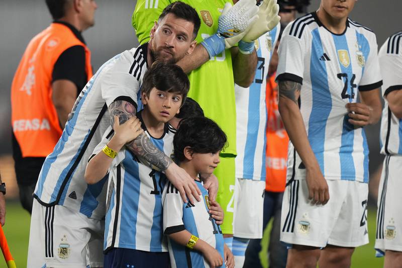 Argentina's Lionel Messi embraces his sons prior to an international friendly match against Panama in Buenos Aires, Argentina, Thursday, March 23, 2023. Argentina won the match 2-0. AP Photo 
