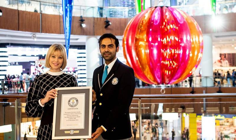 Rebecca Jobo, head of The Dubai Mall, receives the Guinness World Record award. The Dubai Mall