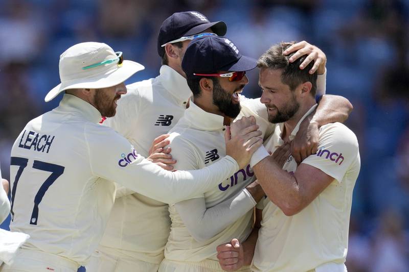 England's Chris Woakes is congraturaled by teammates after the dismissal of West Indies' Jermaine Blackwood. AP
