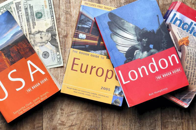 London, United Kingdom - July 20, 2011: Travel guide books for USA, Europe, London and India. These guides are published by Rough Guide and Lonely Planet, the largest travel guide book publisher in the world.