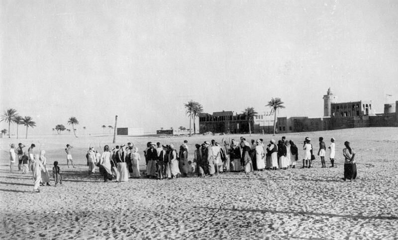 A crowd watches the long jump at a sports day organised during the visit of HMS Owen to Abu Dhabi in February, 1955. Photo: Susan Hillyard