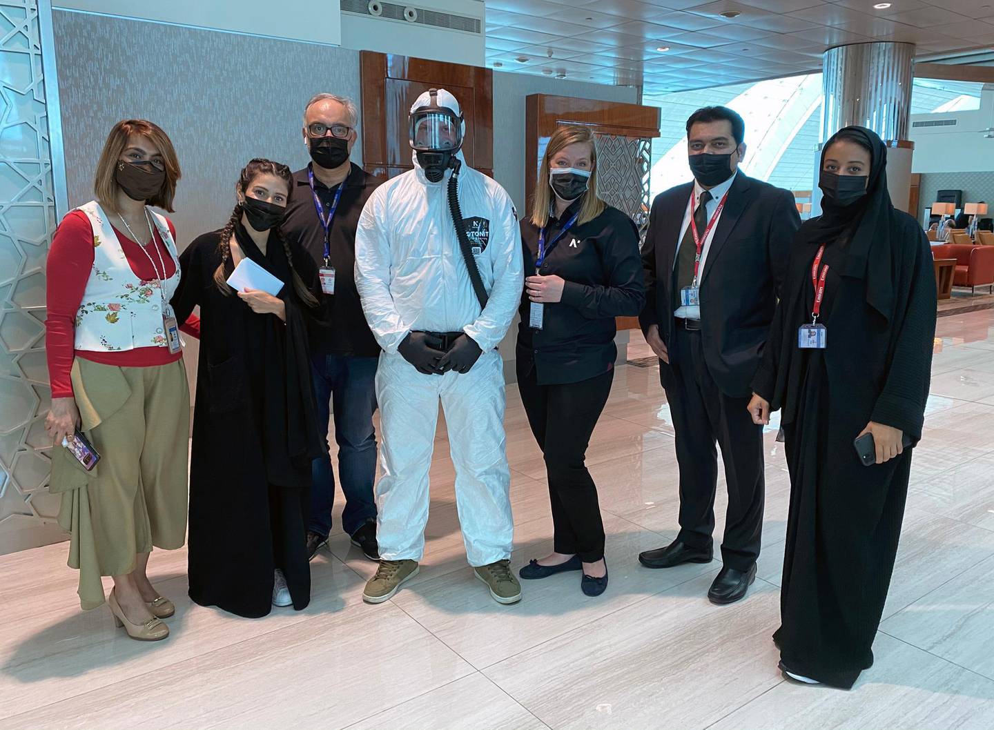 Nanoksi team in Emirates business class lounge at Dubai Airport with Emirates staff members. Nanoksi .
