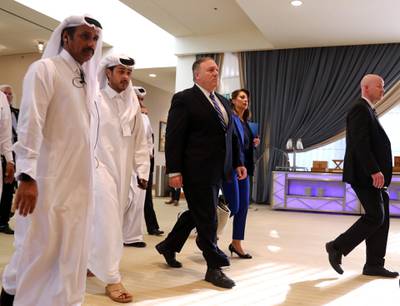 US Secretary of State Mike Pompeo walks ahead of the signing of an agreement between members of Afghanistan's Taliban delegation and the US government in Doha, Qatar. Reuters