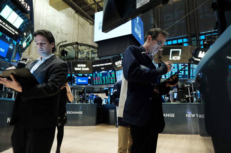 Traders on the floor of the New York Stock Exchange on March 23. Getty via AFP