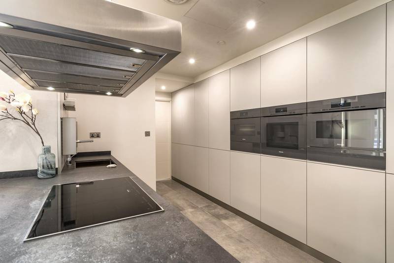 The apartment comes with a very modern kitchen. Courtesy LuxuryProperty.com