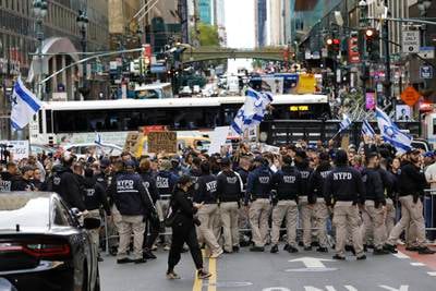 New York City Police hold back Israeli supporters during a protest between Palestinian and Israeli demonstrators. EPA