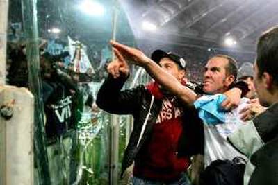 (FILES) Picture dated 06 January 2005  of Lazio's forward Paolo Di Canio gesturing towards Lazio fans at the end of Lazio vs AS Roma Serie A football match at Rome's Olympic stadium. Di Canio is to face a disciplinary hearing over his fascist salute allegedly made by the veteran striker in last month's Rome derby, the Italian football federation (FIGC) said 24 January 2005.  AFP PHOTO/Paolo COCCO