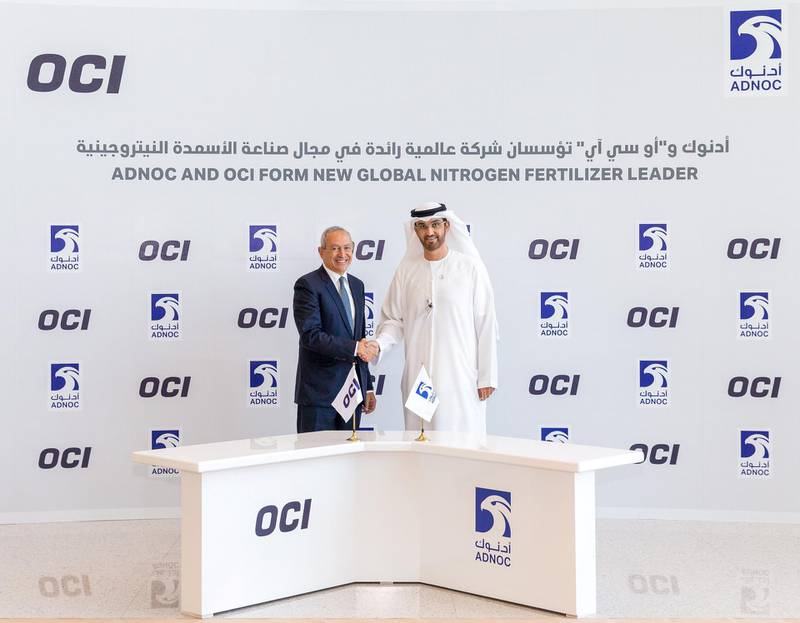 UAE Minister of State and Adnoc chief executive Dr Sultan Al Jaber with Nassef Sawiris, OCI chief executive, in Abu Dhabi on Monday. Photo courtesy of Adnoc
