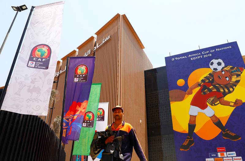 An employee walks in front of a picture of Egyptian mascot for the Africa Cup of Nations, named "TUT" at the Cairo International Stadium ahead of the Africa Cup of Nations opening soccer match between Egypt and Zimbabwe in Cairo, Egypt.  Reuters
