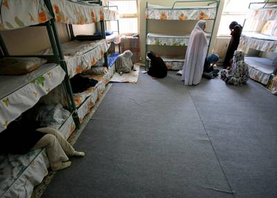 Iranian women prisoners sit inside their cell in Tehran's Evin prison June 13, 2006. Iranian police detained 70 people at a demonstration in favour of women's rights, the judiciary said on Tuesday, adding it was ready to review reports that the police had beaten some demonstrators.  REUTERS/Morteza Nikoubazl (IRAN)