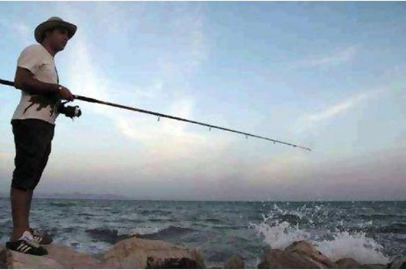 A man casts his line off the coast of Carthage, now a suburb of Tunis.