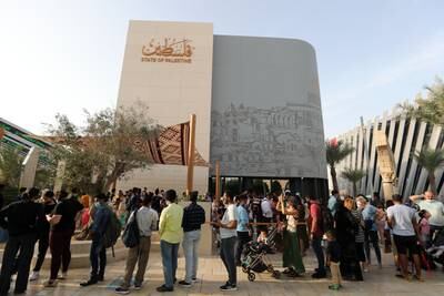 Visitors line up to visit the Palestine pavilion. 