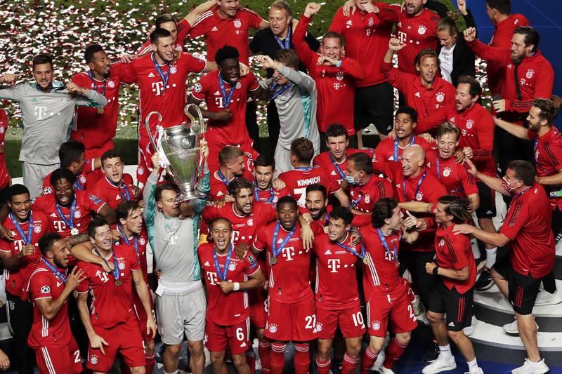 Bayern Munich players celebrate with the trophy. EPA