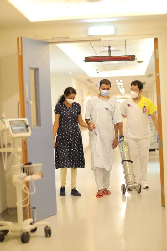 Arunkumar starts walking on his own under the watch of his wife Jenny and a nurse at Burjeel Hospital
