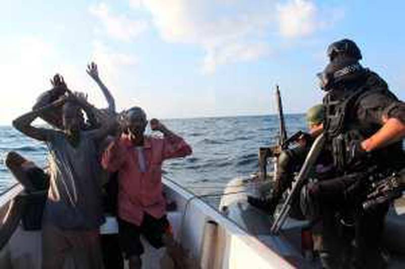In this image made available by NATO Friday Dec. 18, 2009, Marines from the Standing NATO Maritime Group one (SNMG1) flagship, the Portuguese navy frigate NRP ??lvares Cabral?, board a skiff where they identified six suspected pirates, 90 nautical miles off the Somali north coast Friday.(AP Photo/ CPO Carlos Dias, NATO, Ho)  **  EDITORIAL USE ONLY   **