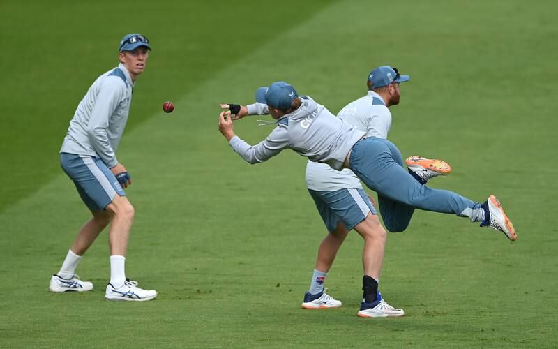 England's Zak Crawley looks on as Ollie Pope attempts a diving catch during nets at Edgbaston. Getty