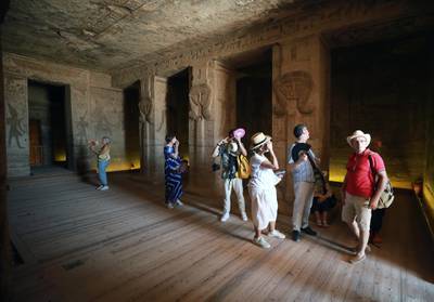 Visitors walk inside the temple of Queen Nefertari at Abu Simbel, Egypt. Tourism in Egypt has taken a beating following the Covid-19 pandemic. EPA