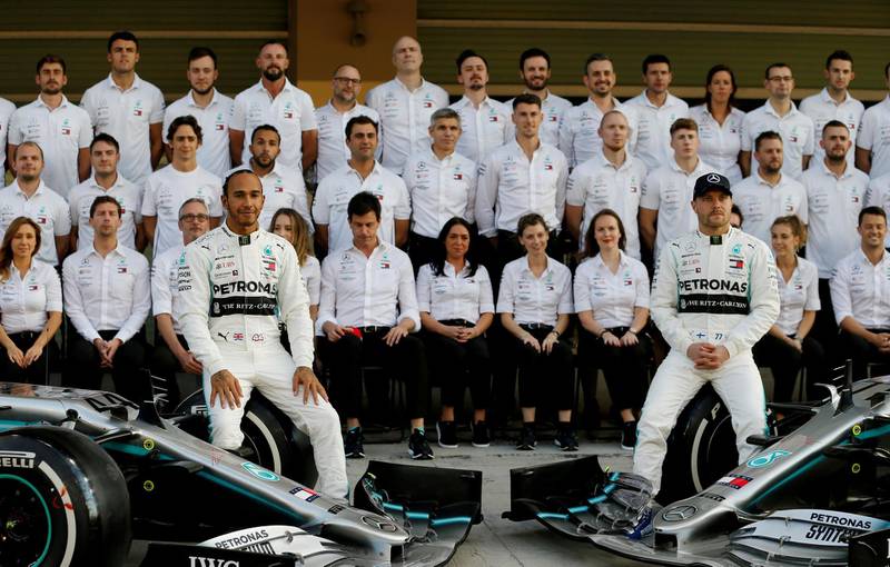 Lewis Hamilton and Valtteri Bottas with the Mercedes team ahead of the 2019 Abu Dhabi GP. Reuters