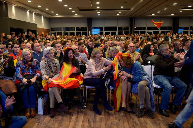 People attend a campaign meeting of Spain's far-right party VOX on November 26, 2018 in Granada.  With a tough line on immigration and Catalan separatism, Spain's tiny far-right party VOX is starting to make waves and could win seats in a regional election for the first time in Andalusia on Sunday. While polls put the Socialists ahead in their traditional southern regional stronghold which they have ruled for the past 36 years, VOX appears on course to win up to five seats in the 109-seat Andalusian parliament in the snap polls.
 / AFP / CRISTINA QUICLER
