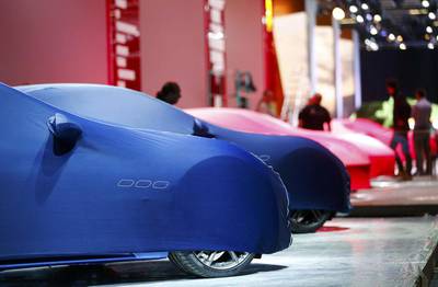 Maseratis, in blue covers, and Ferraris ready for unveiling when the Frankfurt International Motor Show opens. Kai Pfaffenbach / Reuters