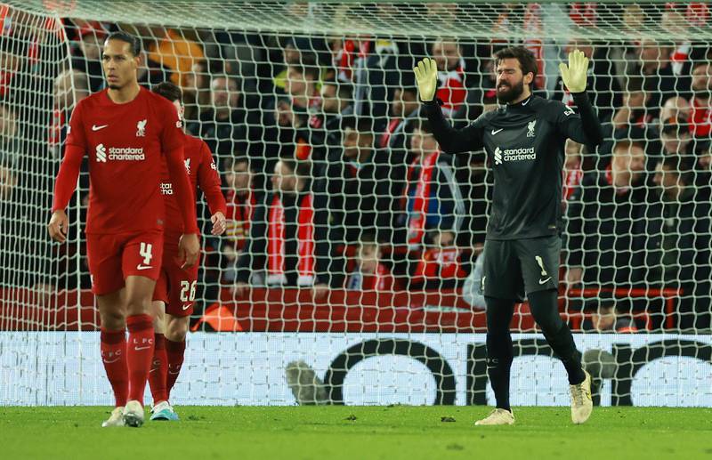 Liverpool's Alisson looks dejected after Karim Benzema's fifth goal for Real. Reuters