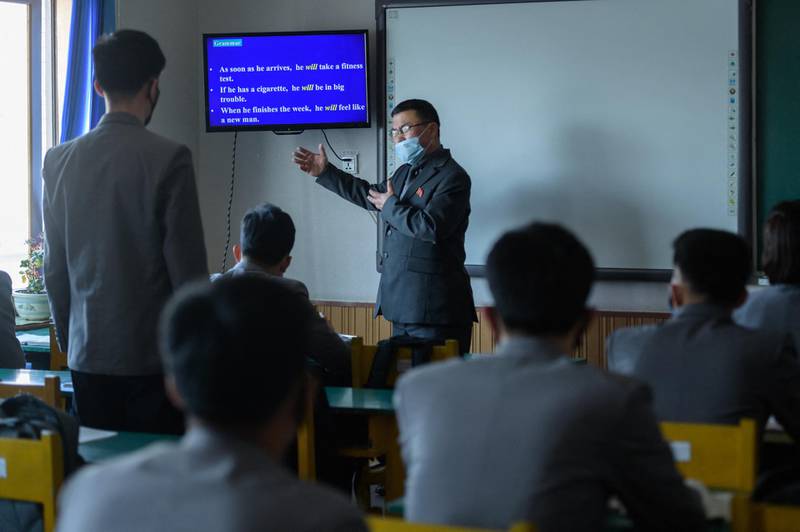 Students wearing face masks attend a lecture at the Pyongyang University of Medicine in Pyongyang on April 22, 2020. - Pyongyang has imposed tight restrictions against the pandemic that has swept the world since emerging in neighbouring China, closing its borders and for a time quarantining thousands of its own citizens as well as hundreds of foreigners, and insists that it has not seen a single case. (Photo by KIM Won Jin / AFP)
