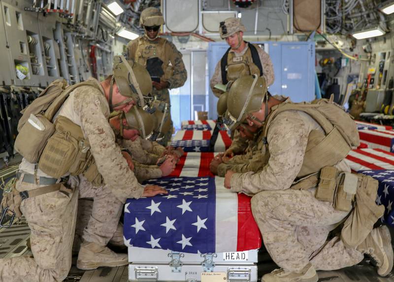 US Marines honour service members killed in Kabul, Afghanistan, at Hamid Karzai International Airport. Reuters