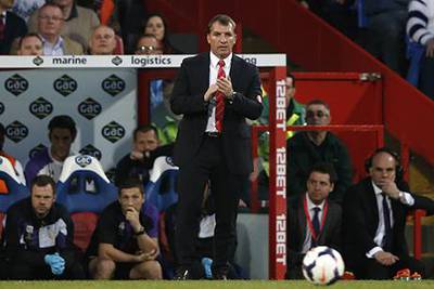 Brendan Rodgers is hoping for some help this weekend. Adrian Dennis / AFP