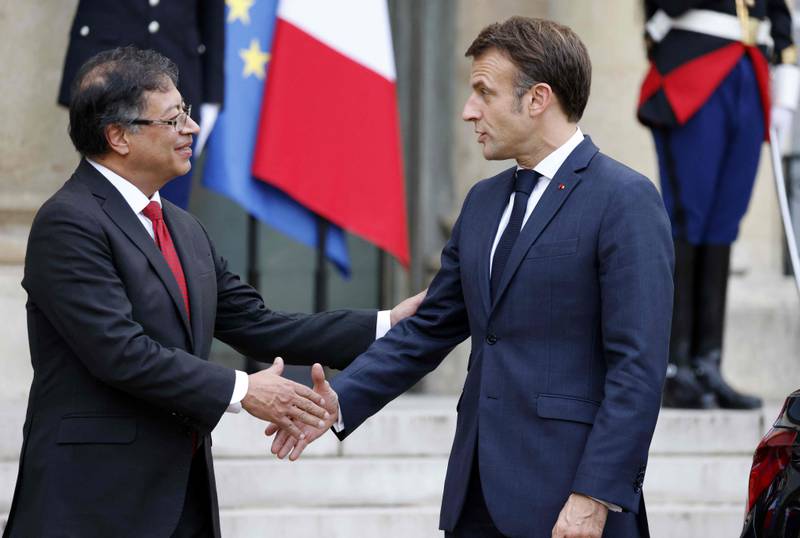 France's Emmanuel Macron with Colombia's President Gustavo Petro, left, after their talks as part of the Paris Peace Forum. AFP