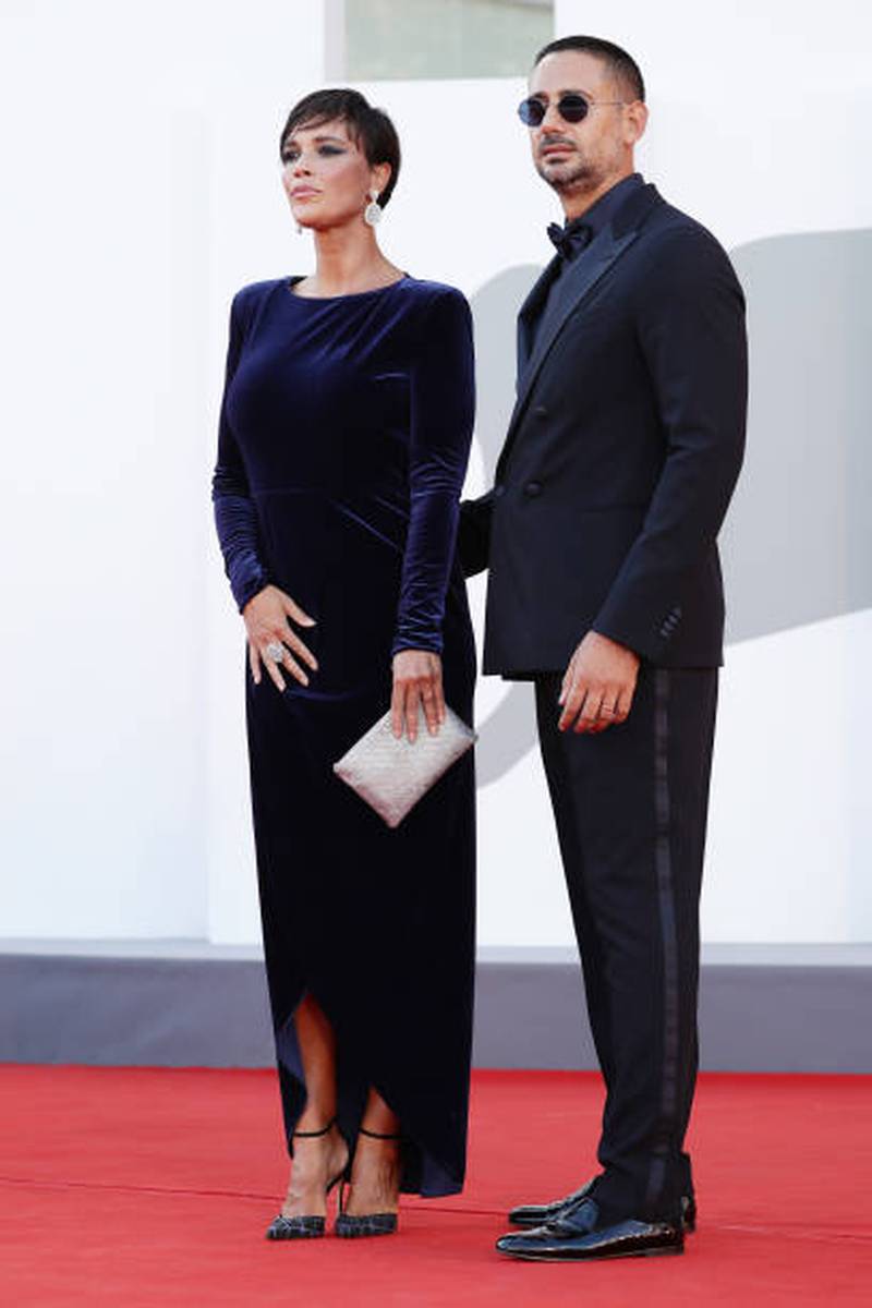 Roberta Giarrusso, in navy, and Riccardo Di Pasquale, in black, attend the red carpet for 'Madres Paralelas' during the 78th Venice International Film Festival on September 1, 2021. Getty Images