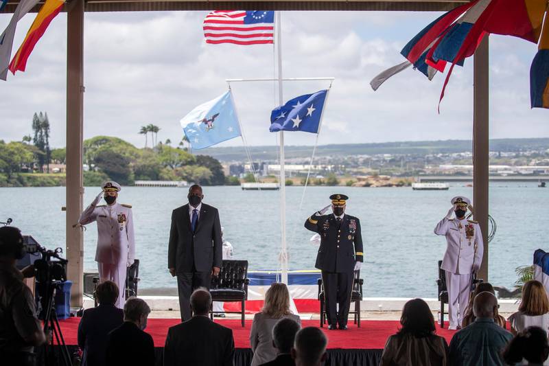 Adm. Philip S. Davidson, left to right, U.S. Secretary of Defense Lloyd J. Austin, Chairman of the Joint Chiefs of Staff Gen. Mark A. Milley and Adm. John C. Aquilino attend a Change of Command ceremony for the U.S Indo-Pacific Command, Friday, April 30, 2021  at Joint Base Pearl Harbor-Hickam west of Honolulu. In his first major speech as Pentagon chief, Lloyd Austin on Friday called for developing a â€œnew visionâ€ for American defense in the face of emerging cyber and space threats and the prospect of fighting bigger wars. (Cindy Ellen Russell/Honolulu Star-Advertiser via AP)