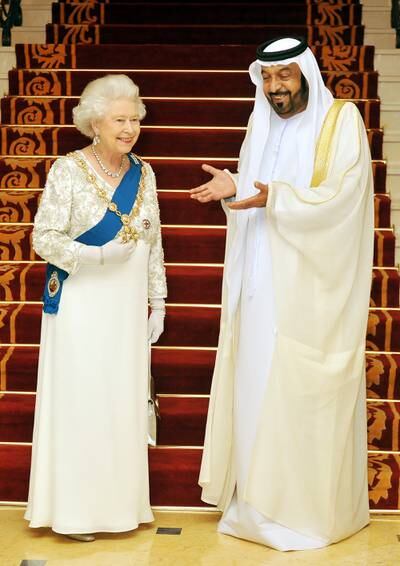 The queen with Sheikh Khalifa, who was then the UAE's President, at Mushrif Palace on November 25, 2010 in Abu Dhabi. Getty