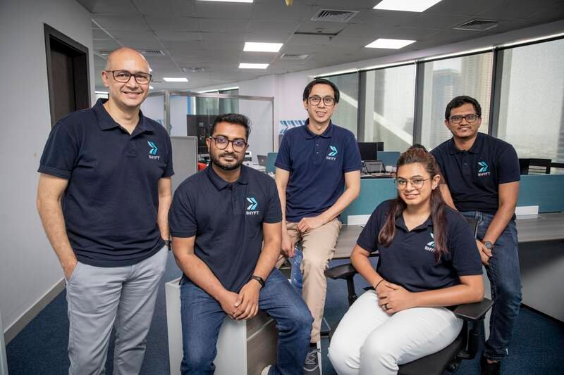 Founder Thawseef Jaleel, far right, with team members, from left, Nadeem Ulde, Arshaad Mohamed, Ferdinand Flores and Sadia Kazmi, who have been with Shyft since its inception. Antonie Robertson / The National