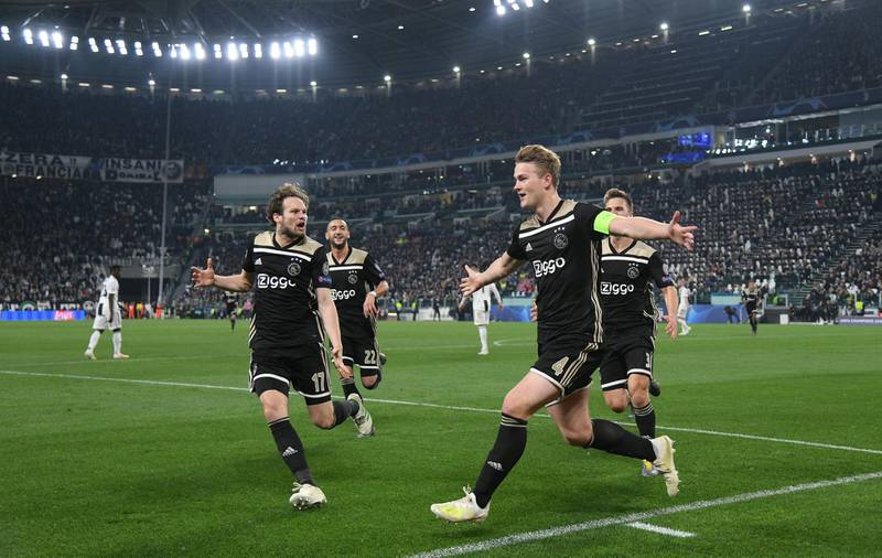 Ajax's Matthijs de Ligt celebrates scoring their second goal with Daley Blind and teammates. Reuters