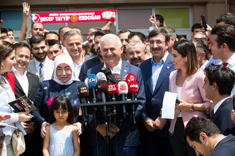 Mr Yildirim reacts as he addresses the media and his supporters. Gurcan Ozturk / AFP