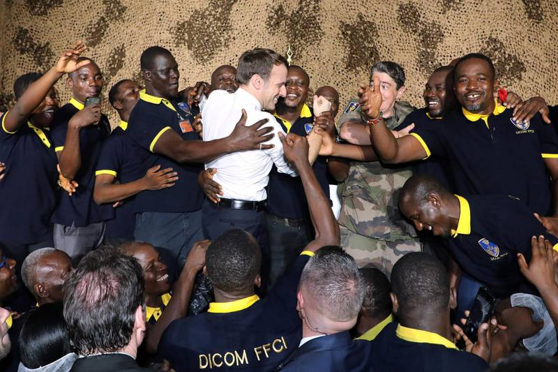 French President Emmanuel Macron celebrates his 42nd birthday with French soldiers.  AFP