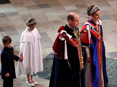 Prince William and Catherine, Princess of Wales, followed by Princess Charlotte and Prince Louis, arrive for the coronation. AP