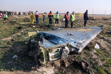 In this file photo taken on January 8, 2020 rescue teams are seen at the scene of a Ukrainian airliner that crashed shortly after take-off near Imam Khomeini airport in the Iranian capital Tehran. AFP