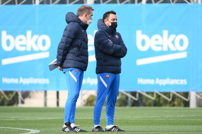 Barcelona manager Xavi Hernandez with his assistant Oscar Hernandez. AFP