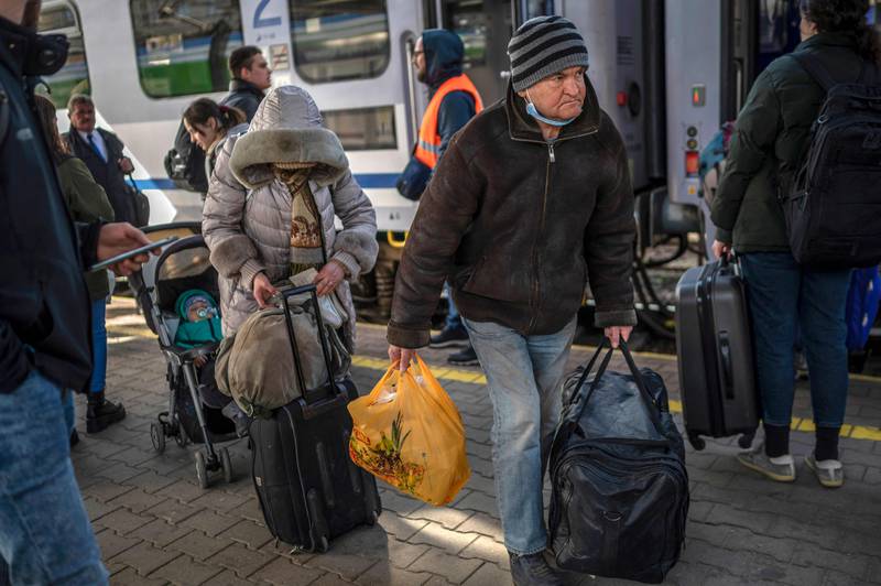 Ukrainian refugees board a train en route to Warsaw at the railway station in Przemysl, near the Polish-Ukrainian border. AFP