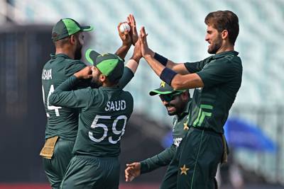 Pakistan's Shaheen Afridi celebrates with teammates after taking the wicket of Bangladesh's Najmul Hossain Shanto. AFP