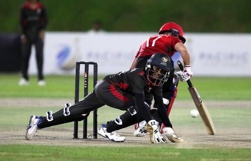UAE wicketkeeper Theertha Satish attempts a catch.